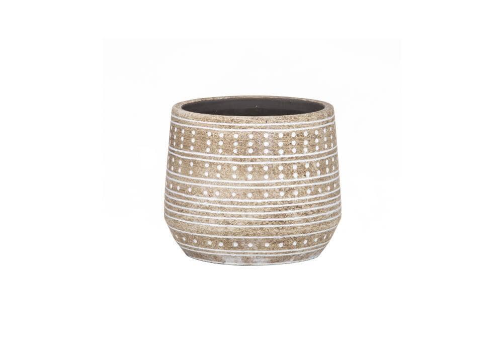 A beige pot with white dots on it.